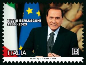 Berlusconi un francobollo in ricordo del Cav ritratto tra bandiere Italia e Ue